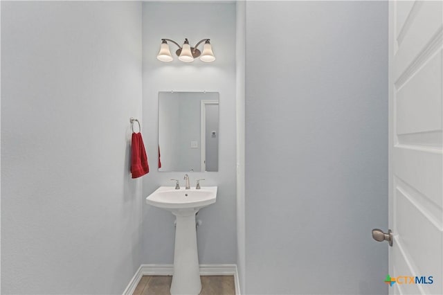 bathroom with tile patterned flooring and baseboards