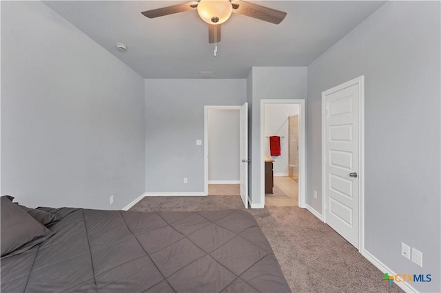 unfurnished bedroom with carpet floors, visible vents, baseboards, and a ceiling fan