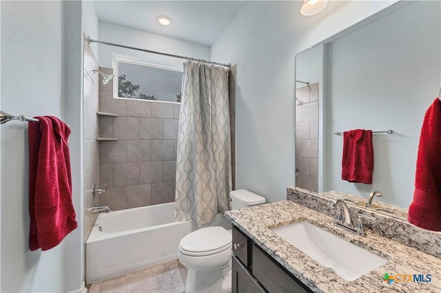 bathroom with toilet, shower / tub combo with curtain, and vanity