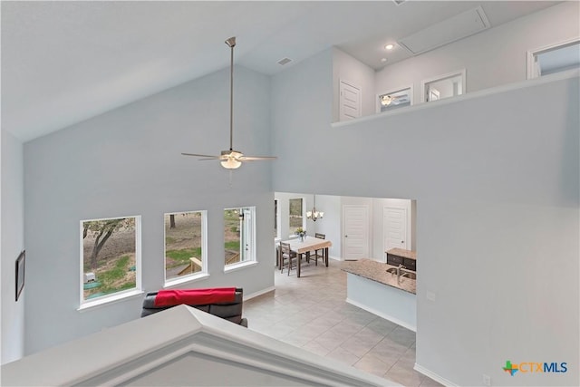 living area with ceiling fan, high vaulted ceiling, light tile patterned flooring, recessed lighting, and baseboards