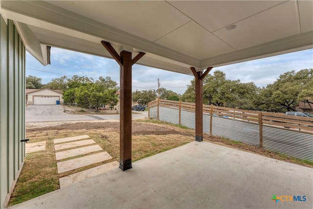 view of patio / terrace featuring fence