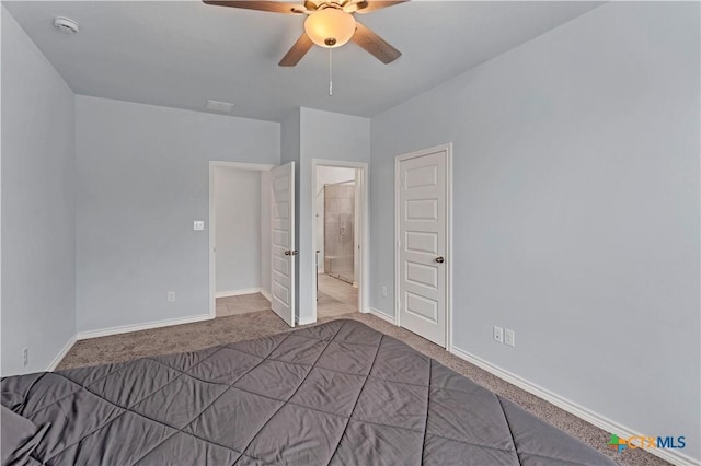 unfurnished bedroom with a ceiling fan, carpet flooring, connected bathroom, and baseboards