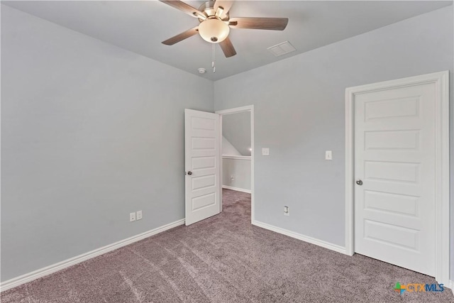 unfurnished bedroom featuring carpet floors, visible vents, baseboards, and ceiling fan