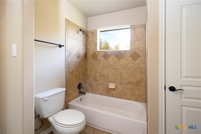 bathroom featuring shower / bathtub combination and toilet