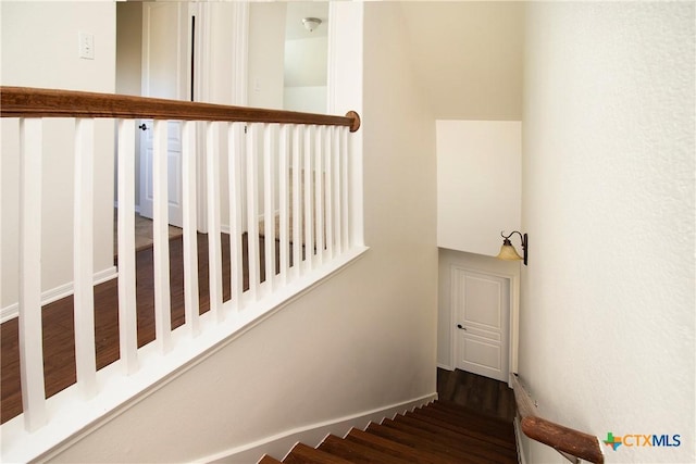 stairs with wood finished floors