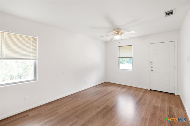 spare room with ceiling fan and light hardwood / wood-style flooring