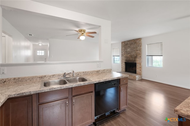 1904 Robert E Lee Dr, Killeen, TX 76543 - kitchen with dishwasher, a sink, open floor plan, a fireplace, and a ceiling fan