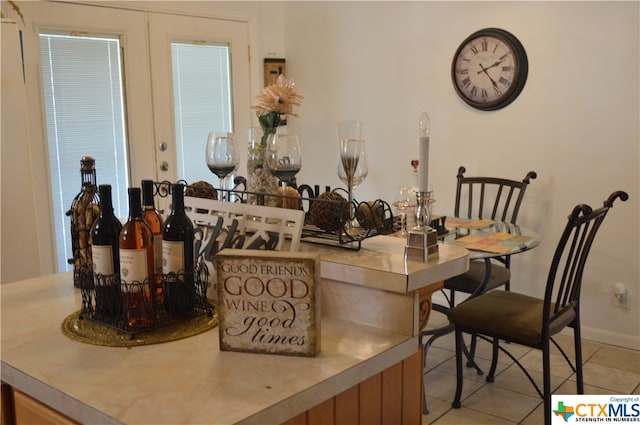 tiled dining space with bar area