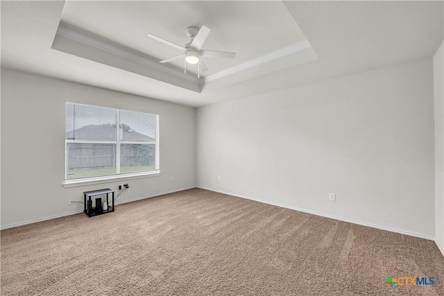 3037 Rain Dance Loop, Harker Heights, TX 76548 - carpeted empty room featuring a tray ceiling, a ceiling fan, baseboards, and ornamental molding