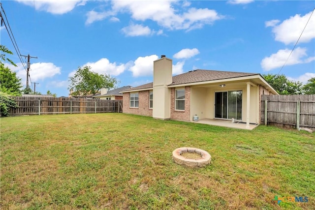 3037 Rain Dance Loop, Harker Heights, TX 76548 - back of property with a patio, brick siding, and a chimney