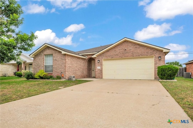3037 Rain Dance Loop, Harker Heights, TX 76548 - single story home with brick siding, central AC, a front yard, and an attached garage