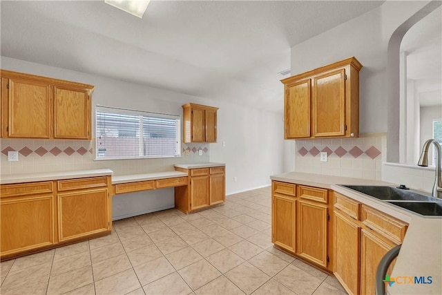 3037 Rain Dance Loop, Harker Heights, TX 76548 - kitchen with a sink, decorative backsplash, and light countertops