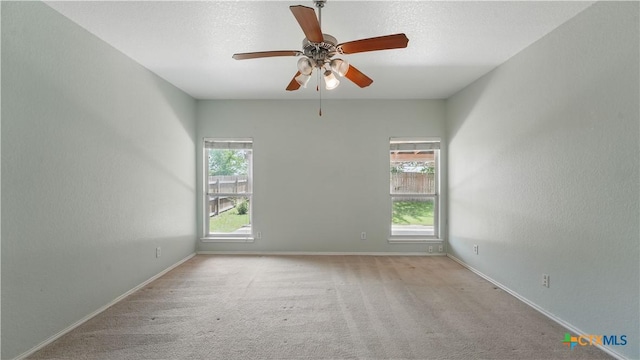 2166 Jolie Ct, New Braunfels, TX 78130 - spare room with plenty of natural light, carpet flooring, and a ceiling fan