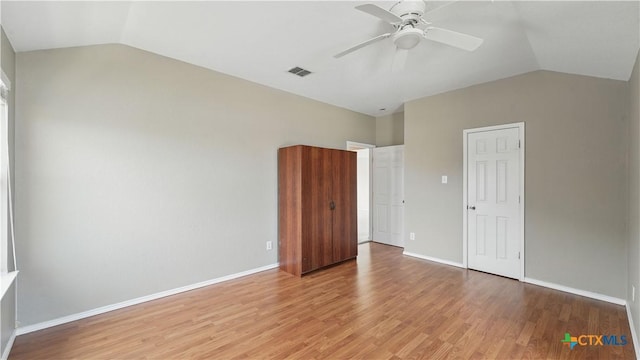 2166 Jolie Ct, New Braunfels, TX 78130 - unfurnished bedroom with vaulted ceiling, light wood finished floors, and a ceiling fan