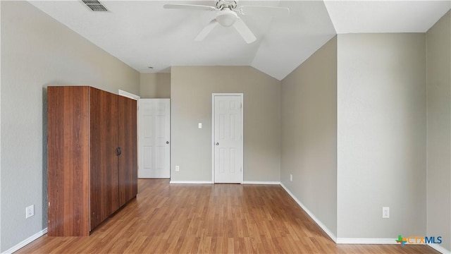 2166 Jolie Ct, New Braunfels, TX 78130 - unfurnished bedroom featuring light wood-style flooring, vaulted ceiling, and a ceiling fan