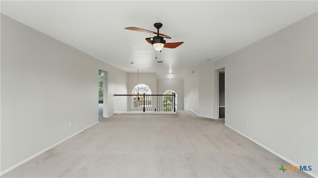 2166 Jolie Ct, New Braunfels, TX 78130 - spare room with a ceiling fan and light colored carpet