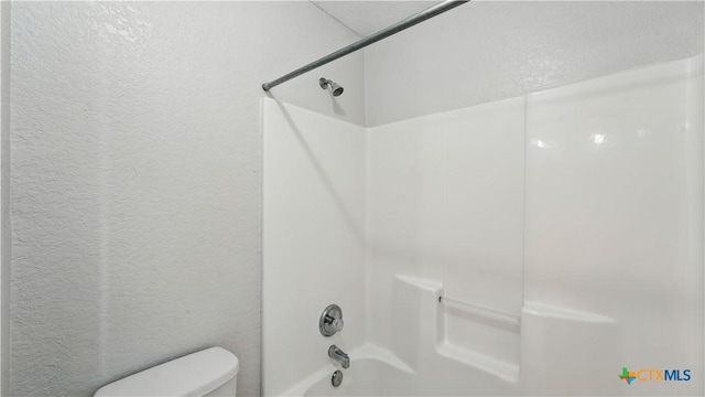 2166 Jolie Ct, New Braunfels, TX 78130 - full bathroom featuring shower / tub combination and a textured wall