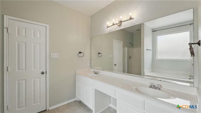 2166 Jolie Ct, New Braunfels, TX 78130 - bathroom featuring double vanity, a garden tub, a shower, and tile patterned floors