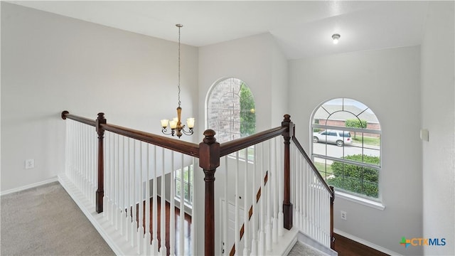 2166 Jolie Ct, New Braunfels, TX 78130 - stairway featuring a chandelier and baseboards