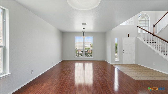 2166 Jolie Ct, New Braunfels, TX 78130 - foyer entrance featuring stairs and wood finished floors
