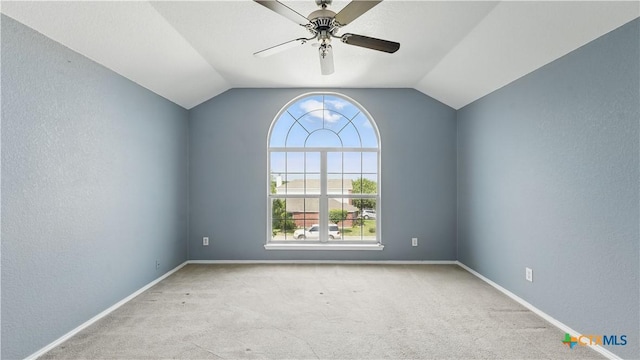 2166 Jolie Ct, New Braunfels, TX 78130 - unfurnished room with carpet flooring, ceiling fan, vaulted ceiling, and a textured wall