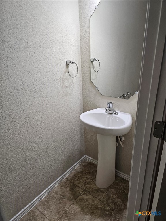 bathroom with tile patterned flooring