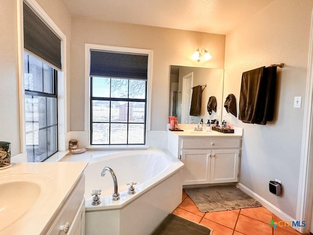 bathroom with vanity, tile patterned floors, and a bathing tub