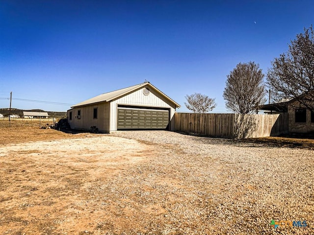 view of side of property with a garage