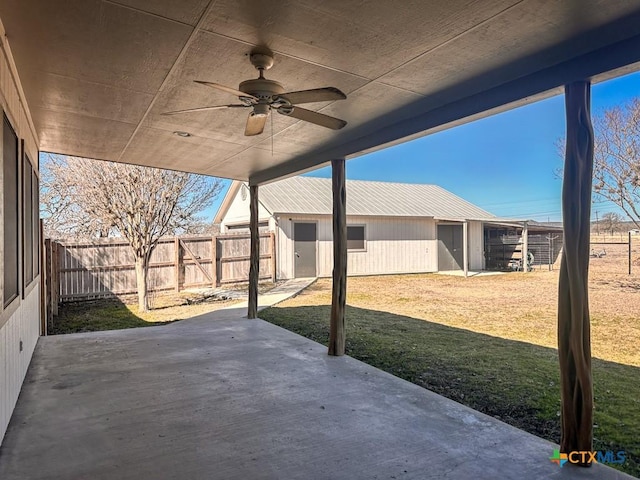 view of patio with a fenced backyard and a ceiling fan