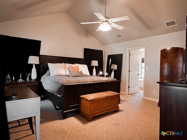 carpeted bedroom with vaulted ceiling and ceiling fan