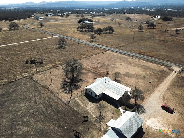 birds eye view of property with a rural view and a mountain view