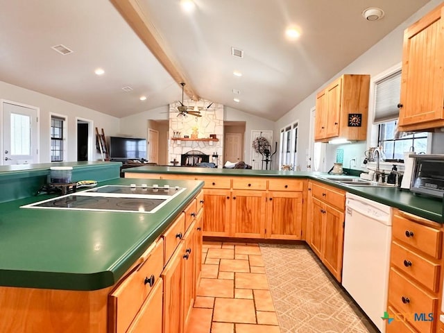 kitchen featuring sink, dishwasher, ceiling fan, vaulted ceiling with beams, and black electric cooktop