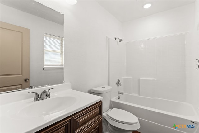 full bathroom featuring shower / tub combination, vanity, and toilet