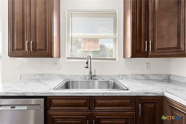 kitchen with dishwasher, dark brown cabinets, and sink