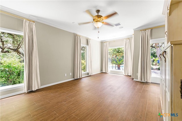 313 Treasure Oaks Rd, Inez, TX 77968 - unfurnished room featuring a ceiling fan, wood finished floors, crown molding, and baseboards