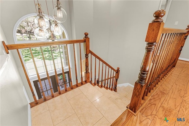 313 Treasure Oaks Rd, Inez, TX 77968 - staircase with a chandelier