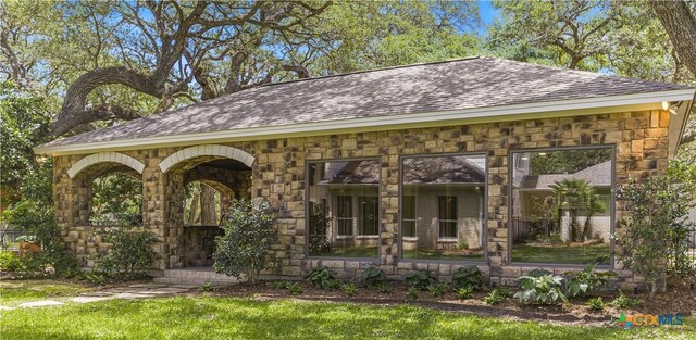 313 Treasure Oaks Rd, Inez, TX 77968 - view of front of home with stone siding and a shingled roof