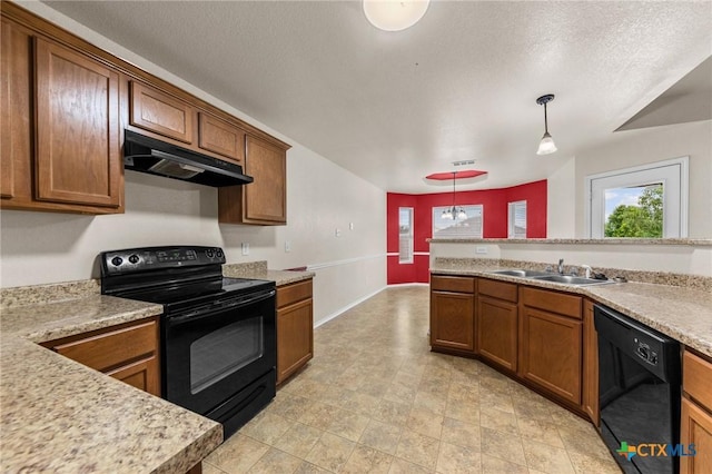 kitchen featuring a sink, under cabinet range hood, black appliances, and light countertops