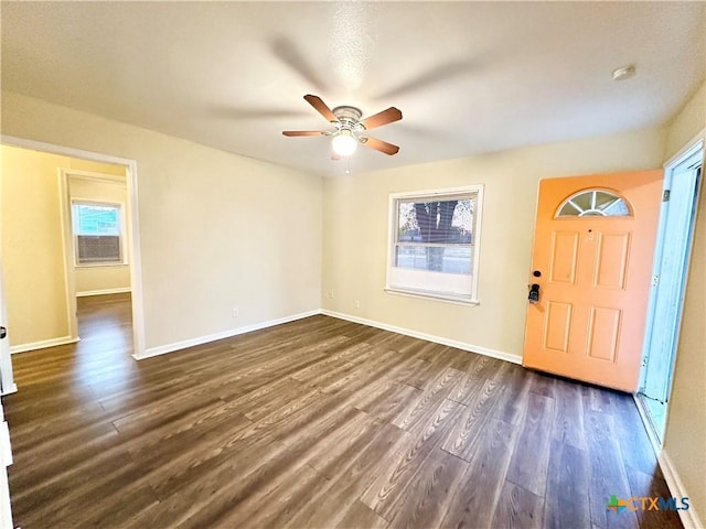 foyer with dark hardwood / wood-style floors and ceiling fan