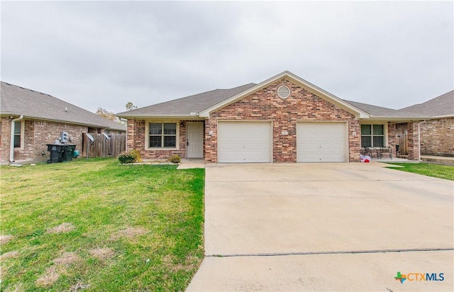 single story home with brick siding, fence, a garage, driveway, and a front lawn