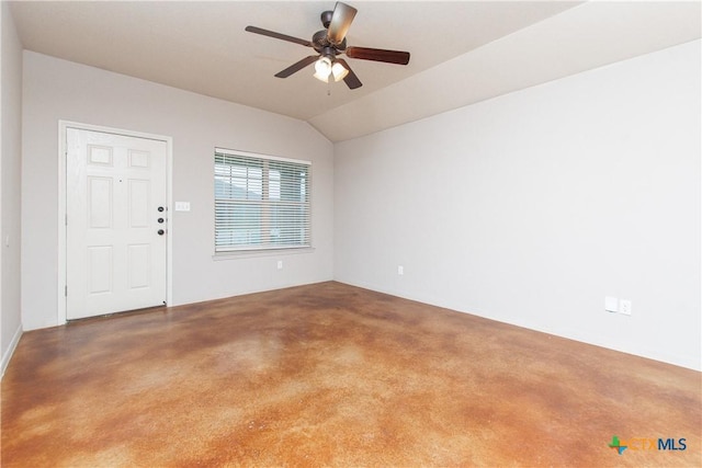 empty room with ceiling fan and lofted ceiling