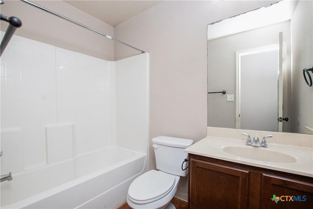 full bathroom with shower / bath combination, vanity, and toilet