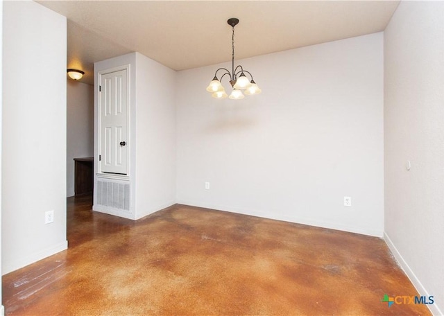 empty room featuring finished concrete floors, baseboards, and an inviting chandelier