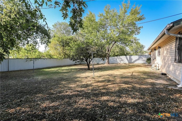 view of yard with a fenced backyard