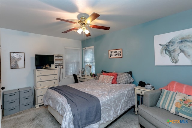 bedroom featuring light carpet and ceiling fan