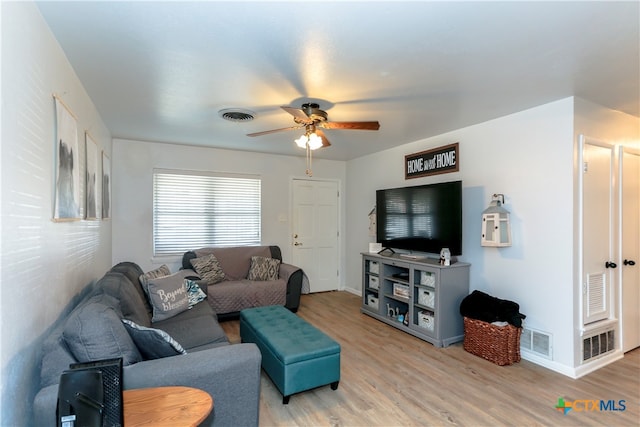 living room featuring ceiling fan and light wood-type flooring