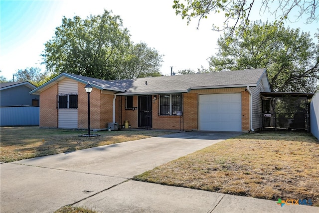 single story home with a garage, brick siding, and driveway