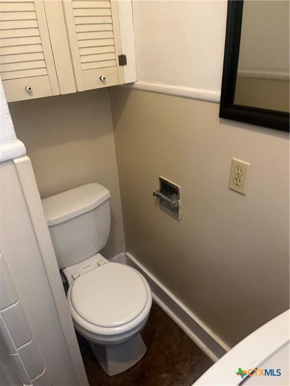 bathroom featuring toilet