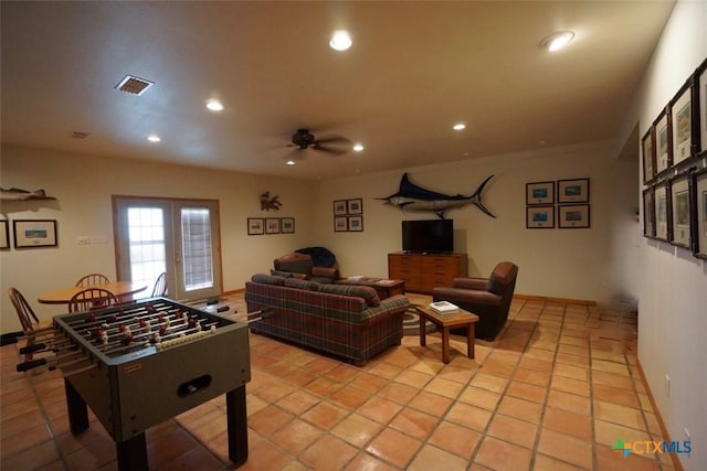 game room with light tile patterned floors, french doors, and ceiling fan