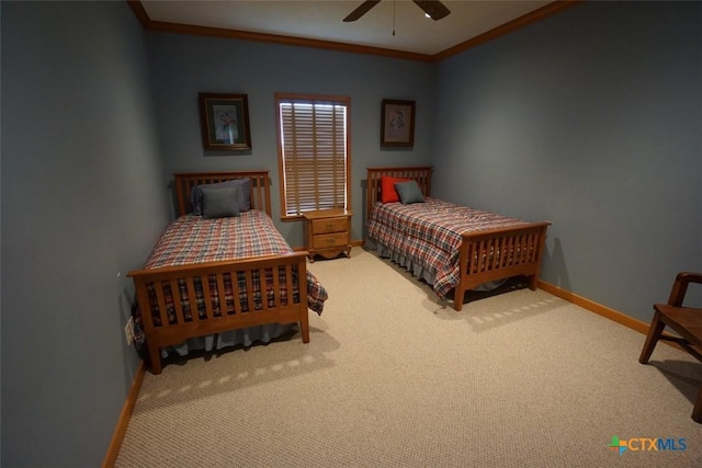 bedroom featuring crown molding, ceiling fan, and carpet